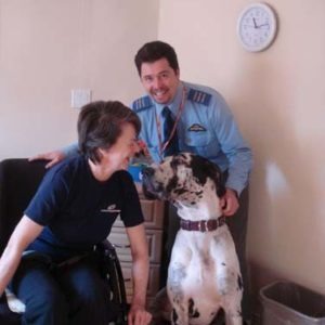 Resident laughing with dog