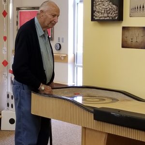 Resident Playing Shuffle Board