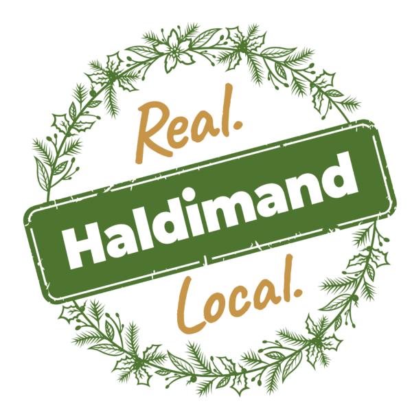 Real. Haldimand. Local. logo. Green festive boughs encircling 'Real. Haldimand. Local' in gold and green text. 